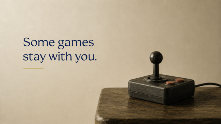 Retro joystick on a dark wooden table beside the text "Some games stay with you."