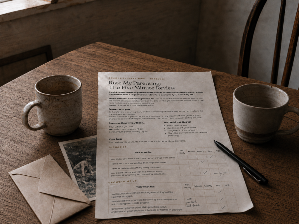A wooden table with two mugs, a pen, an old family photo, an envelope and a printed parenting review form with handwritten notes.